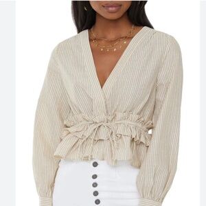 Vici Striped Ruffle Peplum Wrap Blouse in Beige Cream
